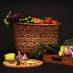 Fresh vegetables on basket and cutting board against black background