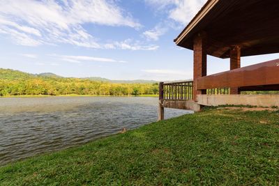 Calm lake with buildings in background