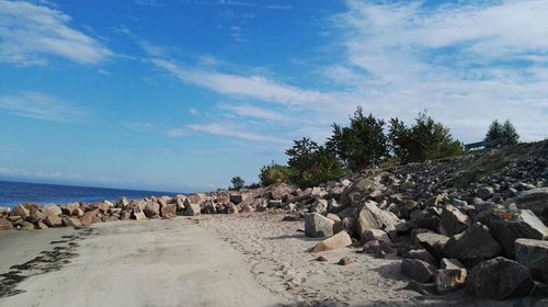 Panoramic view of rocks on landscape against sky