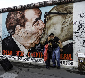 Full length of man standing by text