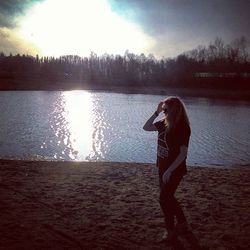 Full length of woman standing on beach