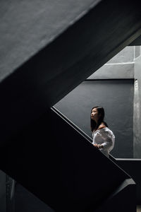 High angle view of woman sitting on floor