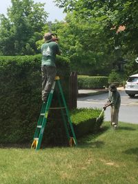 Man working on grassy field