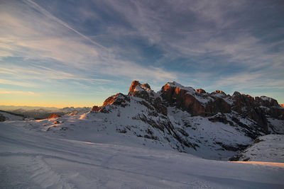 Pale di san martino. unesco italy. scenic view of snowcapped dolomites against sky during sunset.