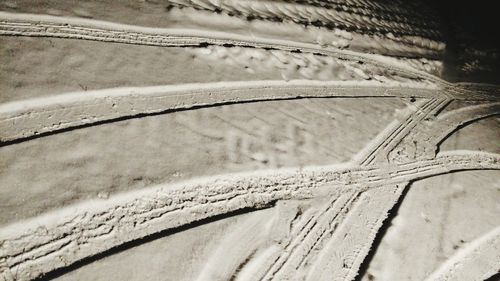 High angle view of tire tracks on snow