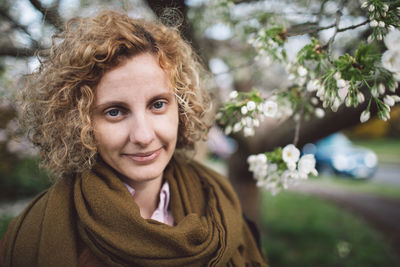 Portrait of smiling woman in public park