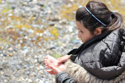 Close-up of woman holding hair