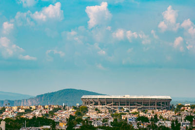 Panoramic shot of townscape by sea against sky