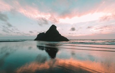 Scenic view of sea against sky at sunset