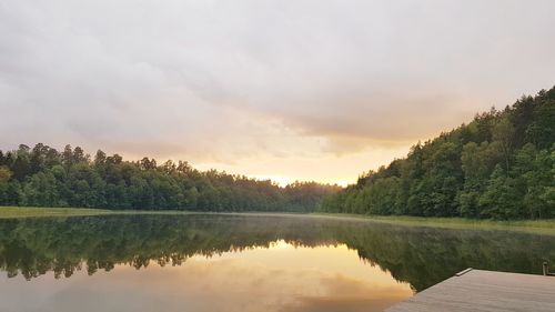 Scenic view of lake against sky during sunset