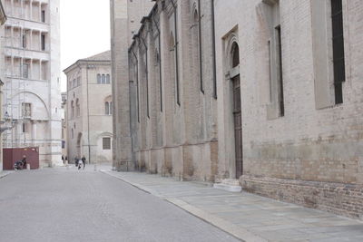 Alley amidst buildings in city