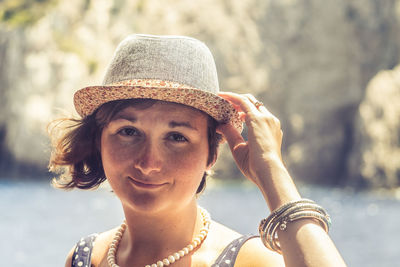 Close-up portrait of woman in sun hat