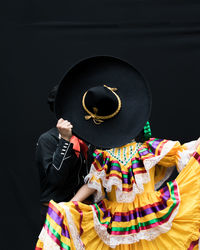 Dancers performing against black background
