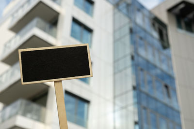 Blank black billboard against new apartment building empty mockup template blackboard label home for