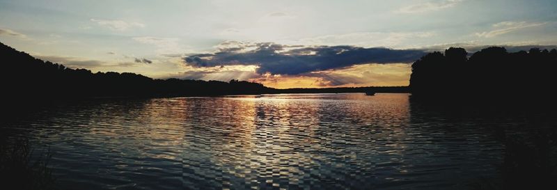 Scenic view of lake at sunset