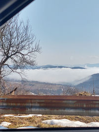 Scenic view of frozen lake against sky during winter