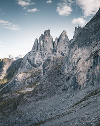 Scenic view of mountains against cloudy sky