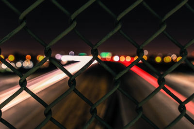 Close-up of illuminated chainlink fence