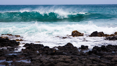 Scenic view of rocks on beach