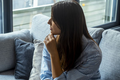 Young woman looking at home