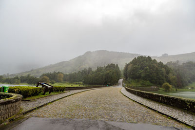 Scenic view of landscape against sky during rainy season