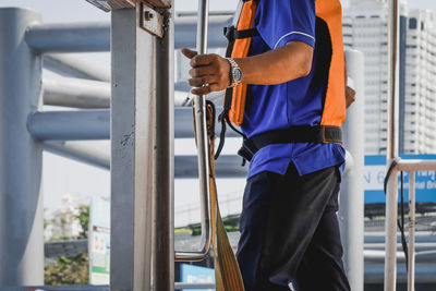 Man working on railing