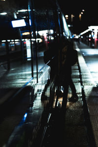 People on footpath at night