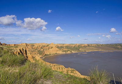 Scenic view of land against sky