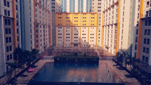 Canal amidst buildings in city