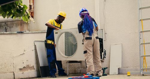 Rear view of man working at construction site