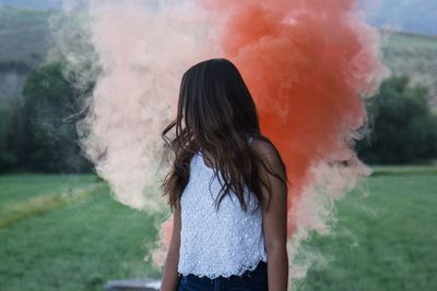 Young woman standing outdoors