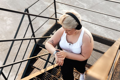 High angle view of woman on railing