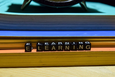Close-up of telephone booth on table