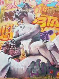Full frame shot of multi colored graffiti