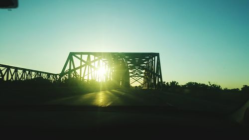 Low angle view of sun against clear sky