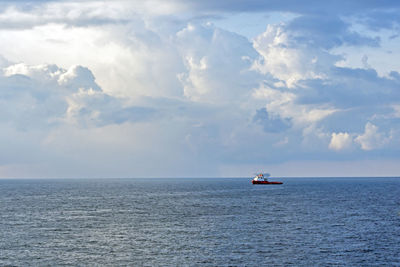 An anchor handling tug boat maneuvering at offshore oil field