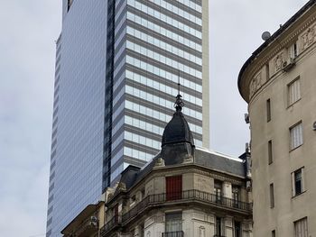 Low angle view of skyscrapers against sky