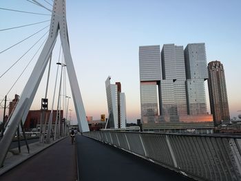 View of bridge in city against clear sky