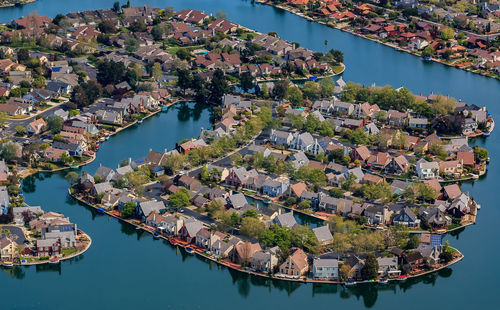 High angle view of townscape by sea