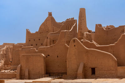 Low angle view of old ruins against clear sky