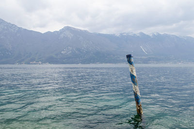 Scenic view of lake against mountain range