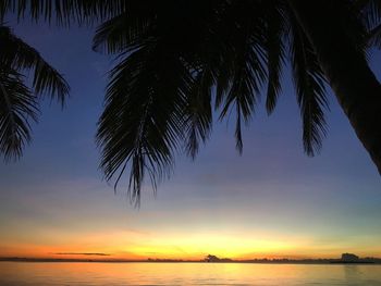 Scenic view of sea against sky at sunset