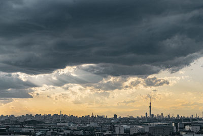 Cityscape against sky during sunset