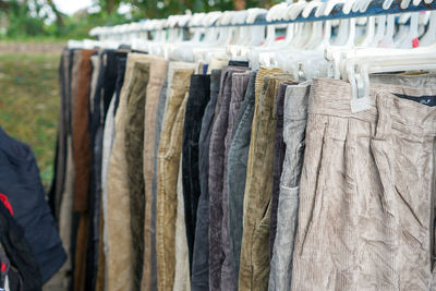 Second hand clothes and pants with quality brands imported from abroad are sold on the roadside.