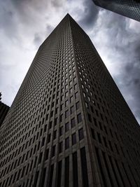 Low angle view of skyscraper against sky