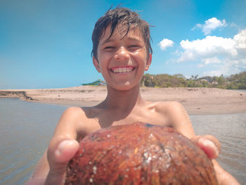 Portrait of smiling boy on beach