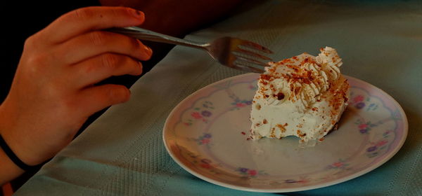 Close-up of hand holding ice cream