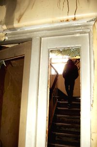 Full length of woman standing by railing