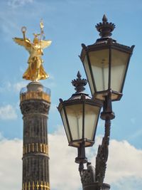 Low angle view of statue against cloudy sky