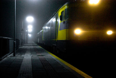 Illuminated railroad station at night